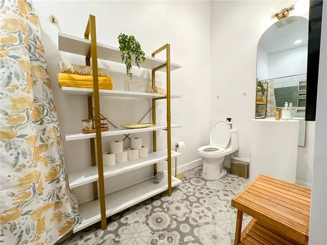 a bed room with a bed and a television