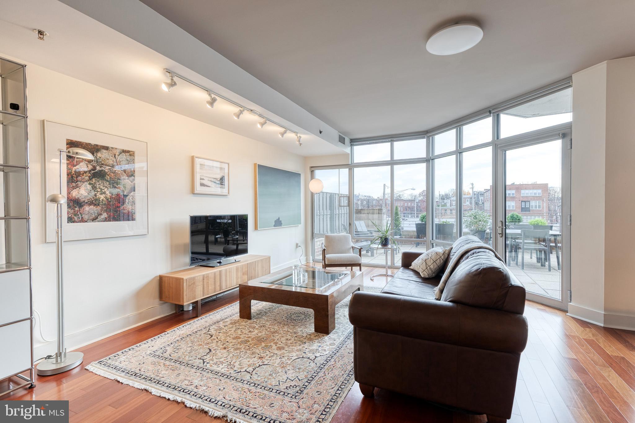 1400 Lancaster Street, Unit 305 Baltimore, MD 21231 - Photo 7 of 43 Living Room - Floor to Ceiling Windows