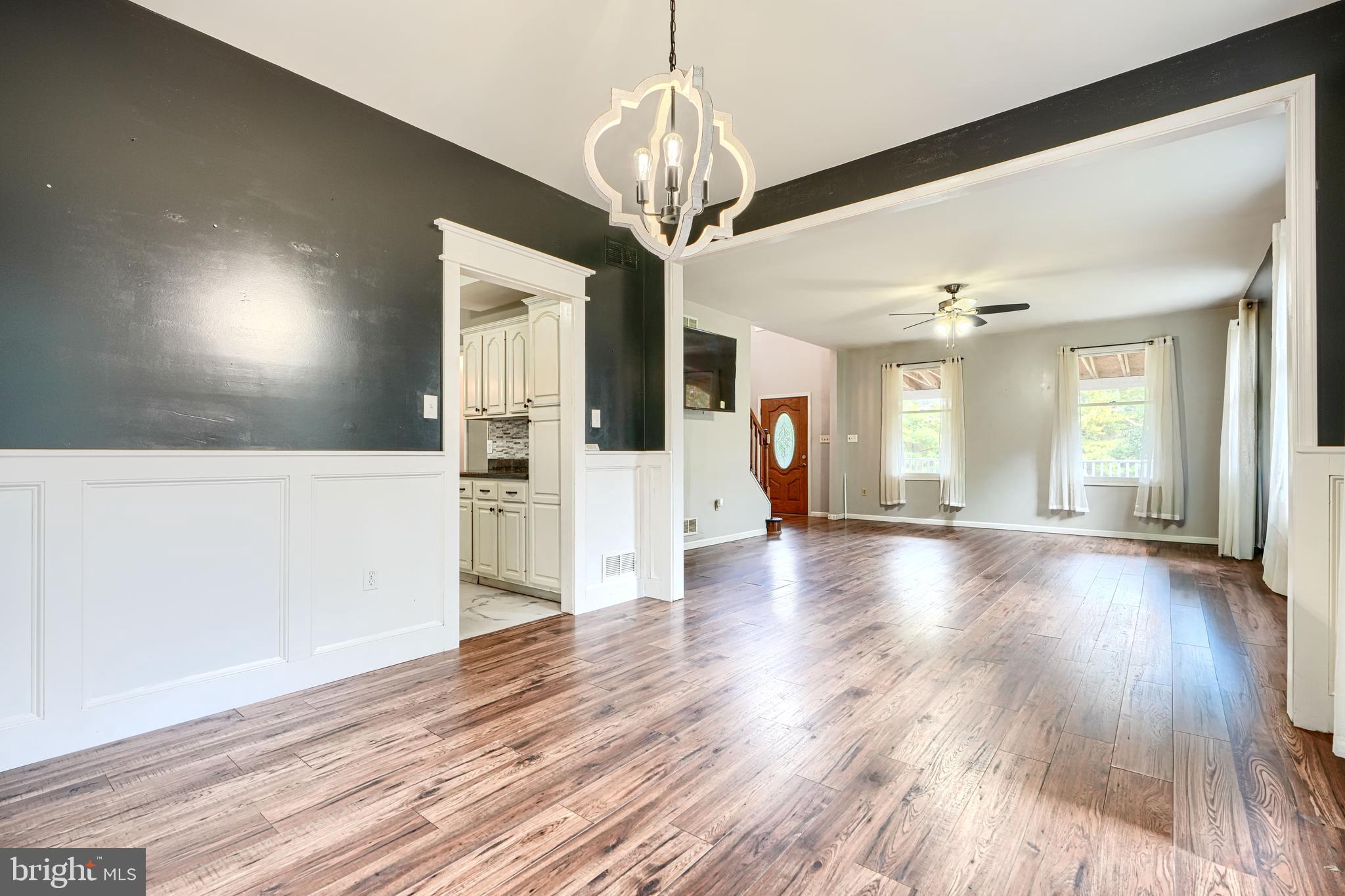 544 Elk Mills Road Elkton, MD 21921 - Photo 12 of 65 a view of a big room with wooden floor and windows