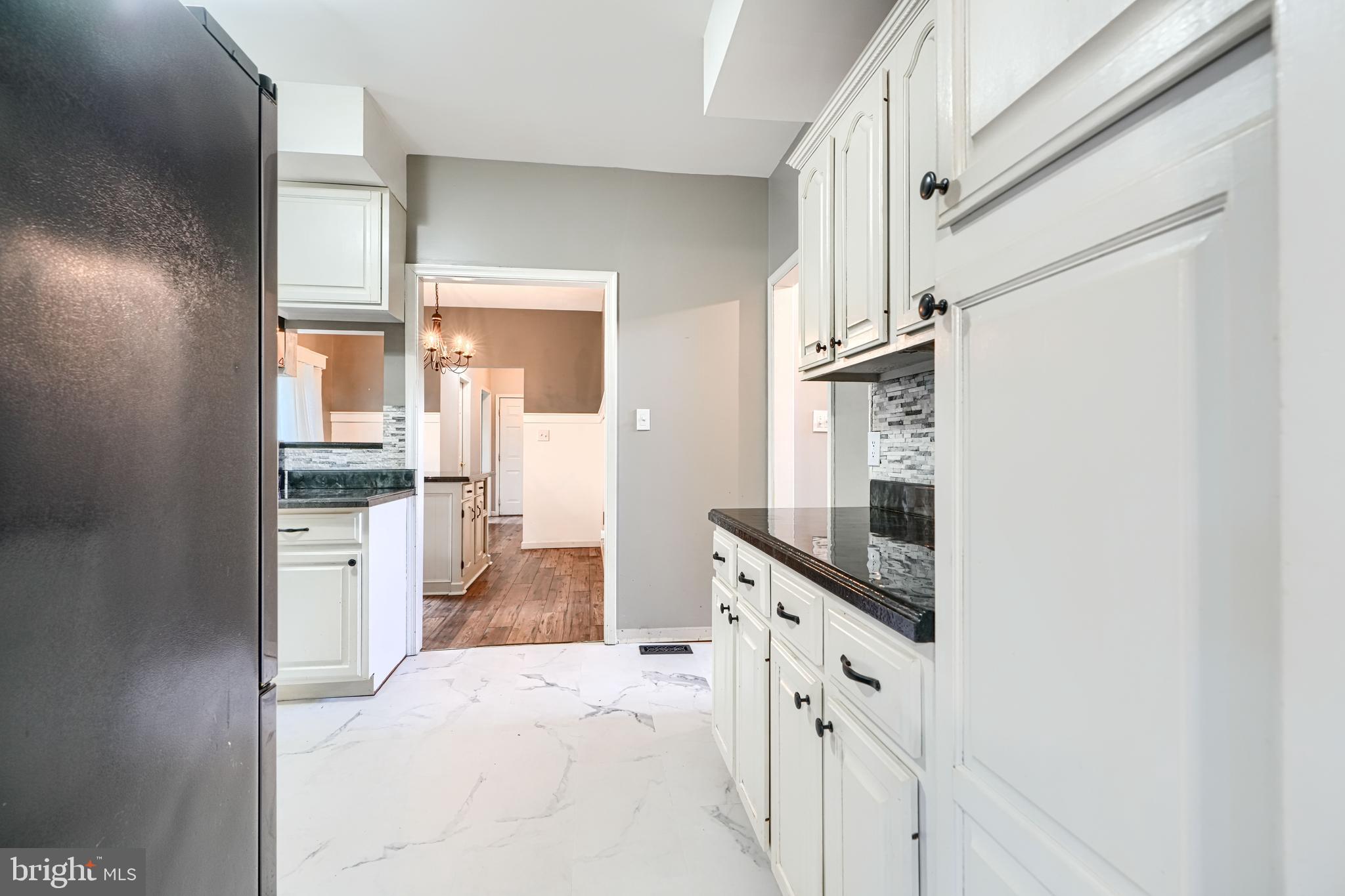 544 Elk Mills Road Elkton, MD 21921 - Photo 13 of 65 a kitchen with granite countertop cabinets and refrigerator