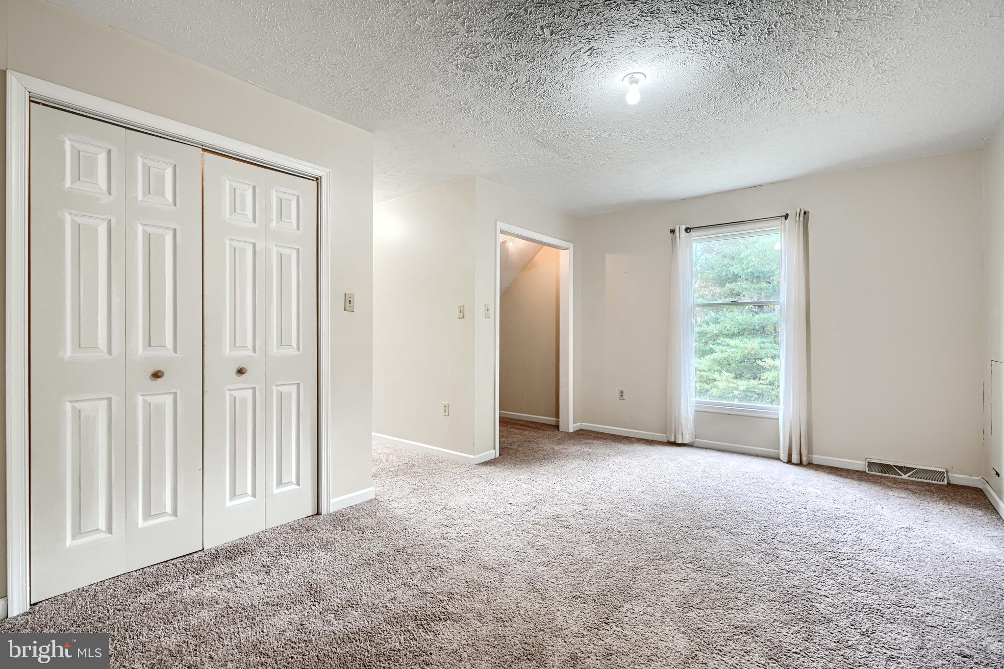 544 Elk Mills Road Elkton, MD 21921 - Photo 37 of 65 an empty room with windows and closet