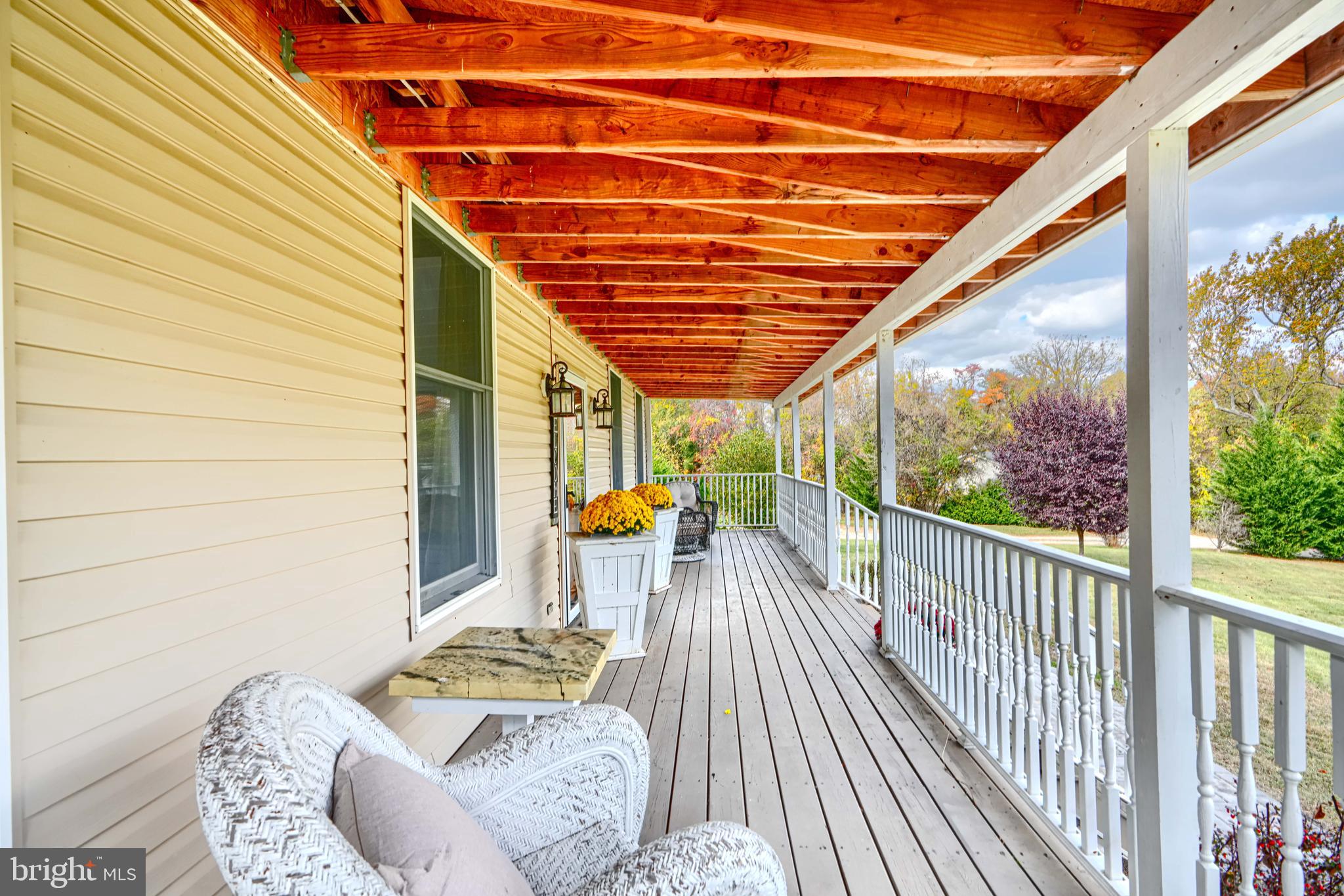 544 Elk Mills Road Elkton, MD 21921 - Photo 4 of 65 a view of balcony with couch and chairs
