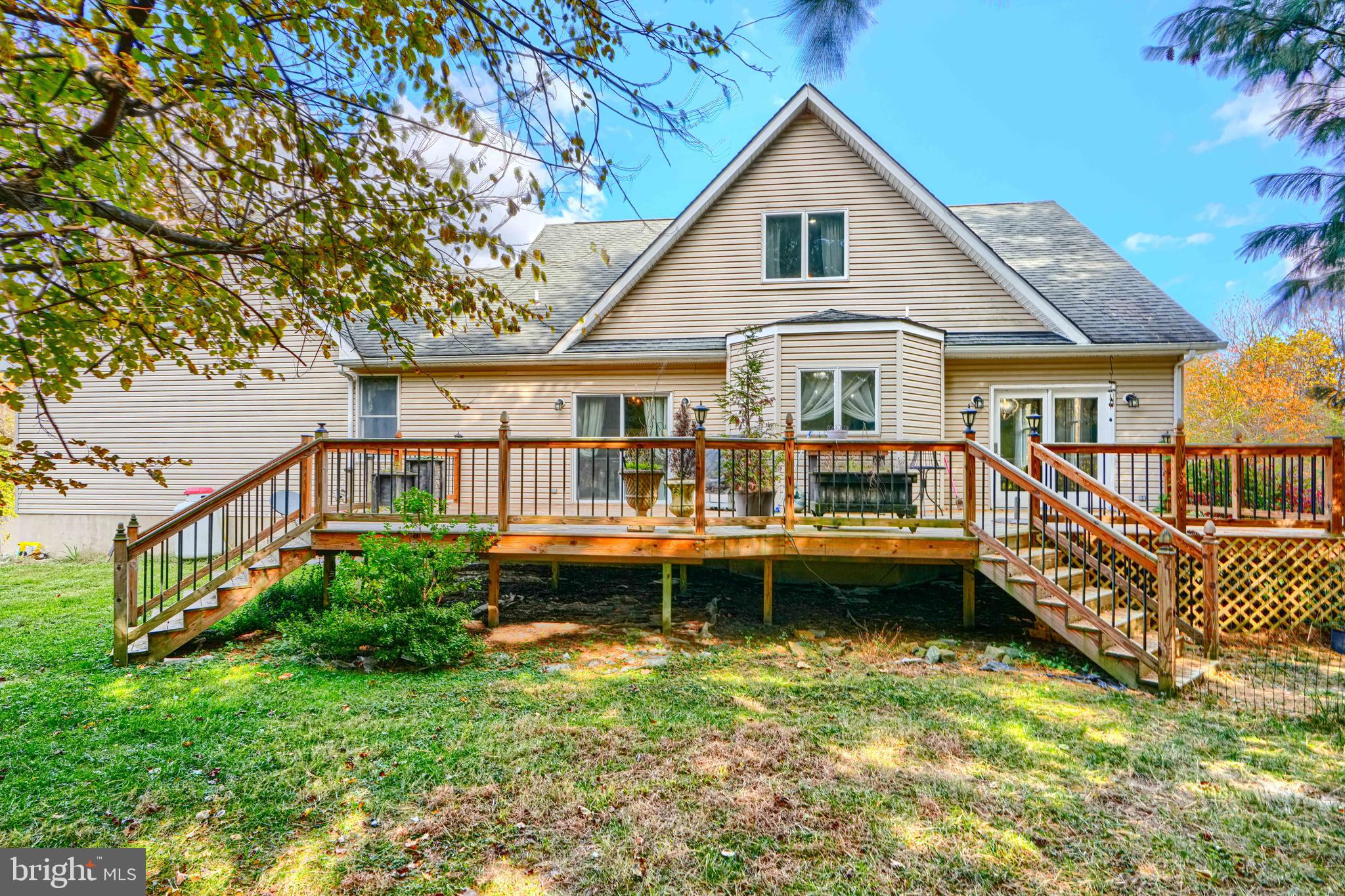 544 Elk Mills Road Elkton, MD 21921 - Photo 52 of 65 a view of a house with a wooden deck and a yard