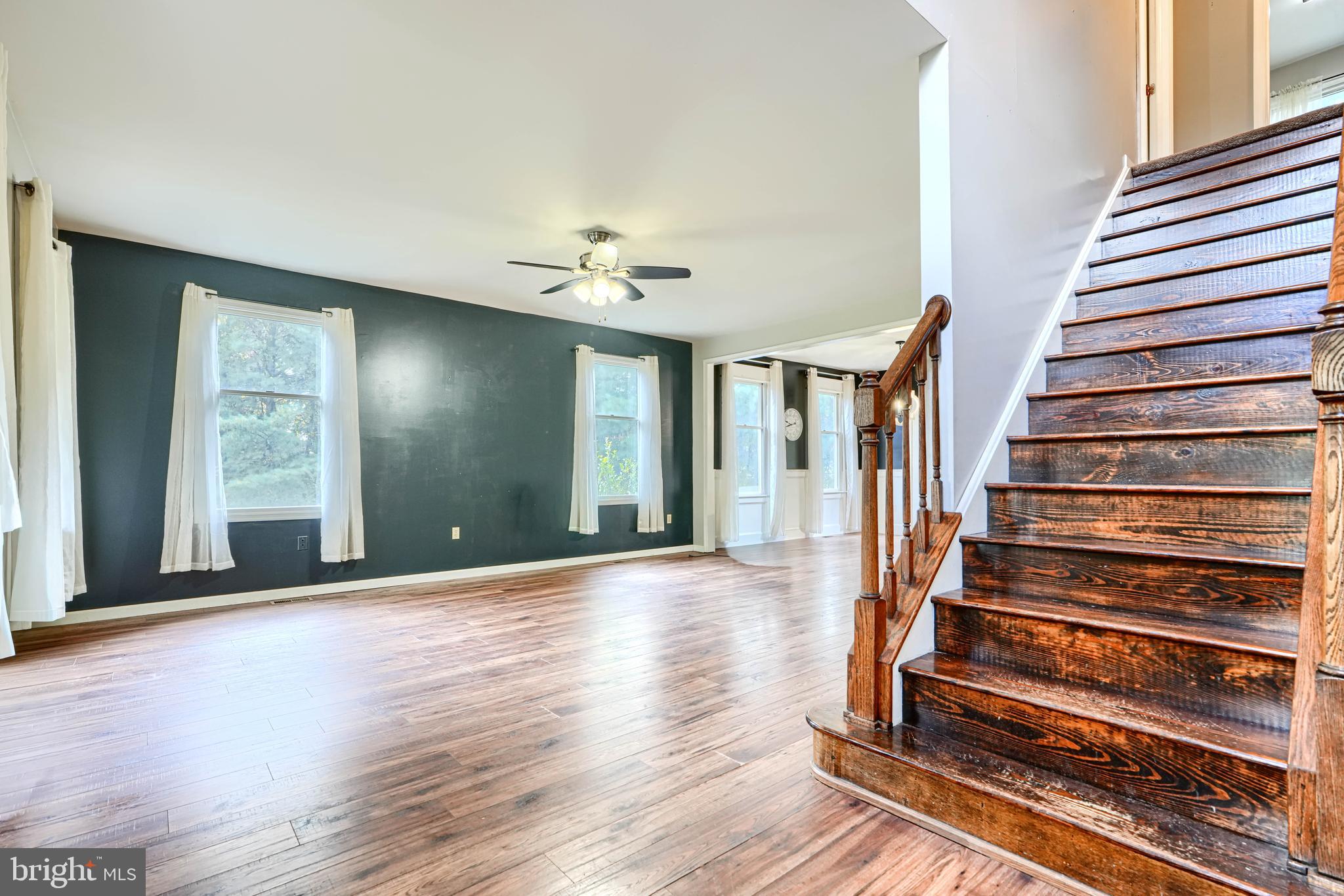 544 Elk Mills Road Elkton, MD 21921 - Photo 6 of 65 a view of a room with wooden floor and stairs