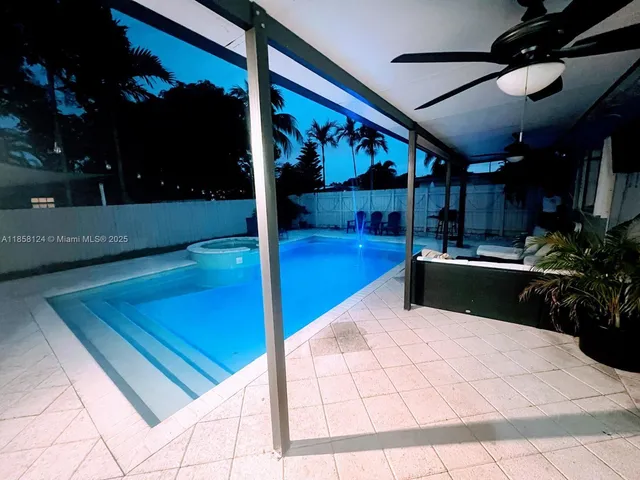 a view of a patio with a table and chairs
