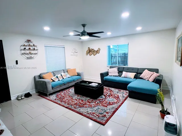 a living room with furniture and a rug