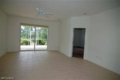 4708 Fairloop Run Lehigh Acres, FL 33973 - Photo 5 of 10 a view of an empty room with a window