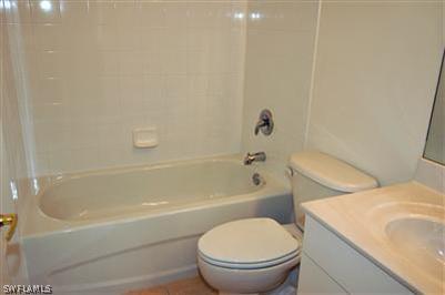 4708 Fairloop Run Lehigh Acres, FL 33973 - Photo 9 of 10 a bathroom with a sink and a toilet