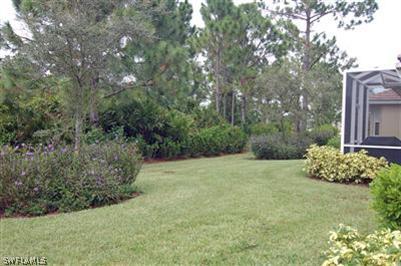 4708 Fairloop Run Lehigh Acres, FL 33973 - Photo 10 of 10 a view of a backyard