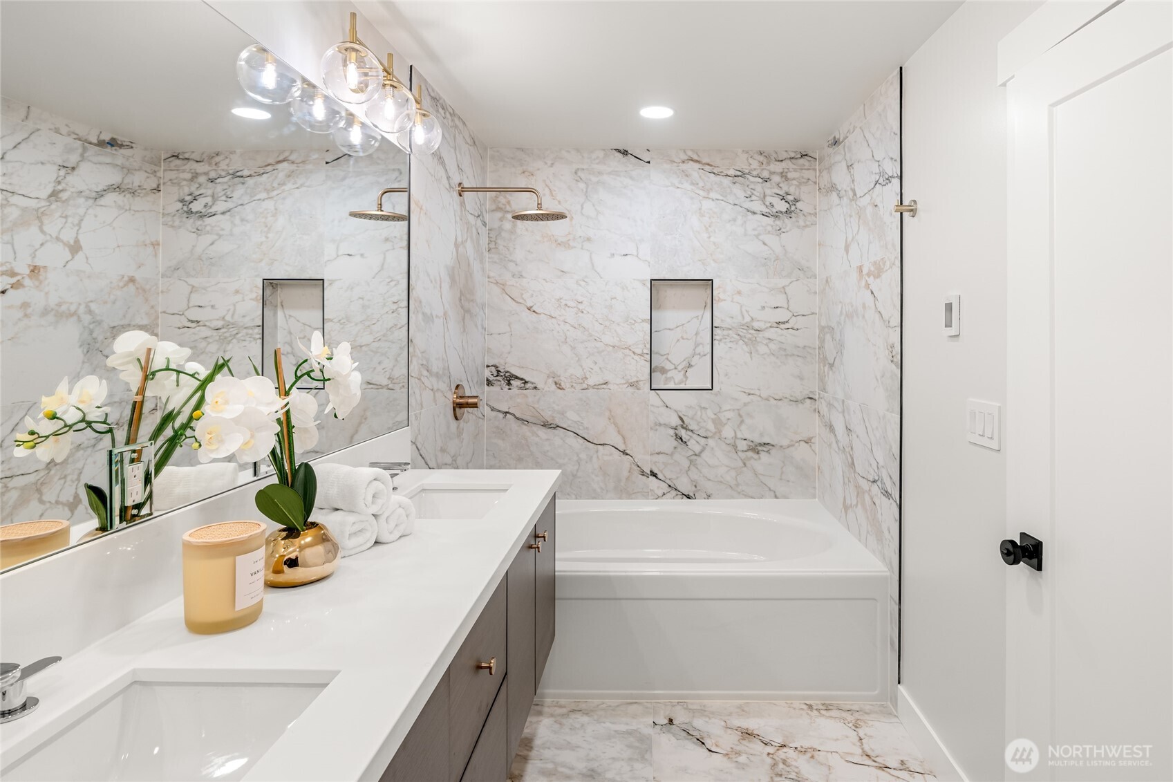 1616 21st Avenue Seattle, WA 98122 - Photo 15 of 26 a bathroom with a granite countertop sink a mirror and shower