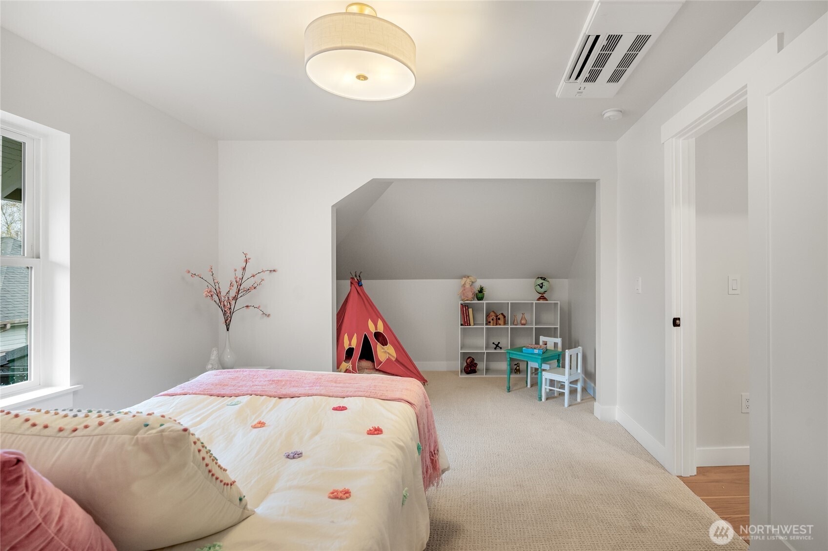 1616 21st Avenue Seattle, WA 98122 - Photo 16 of 26 a bedroom with a bed and a large window