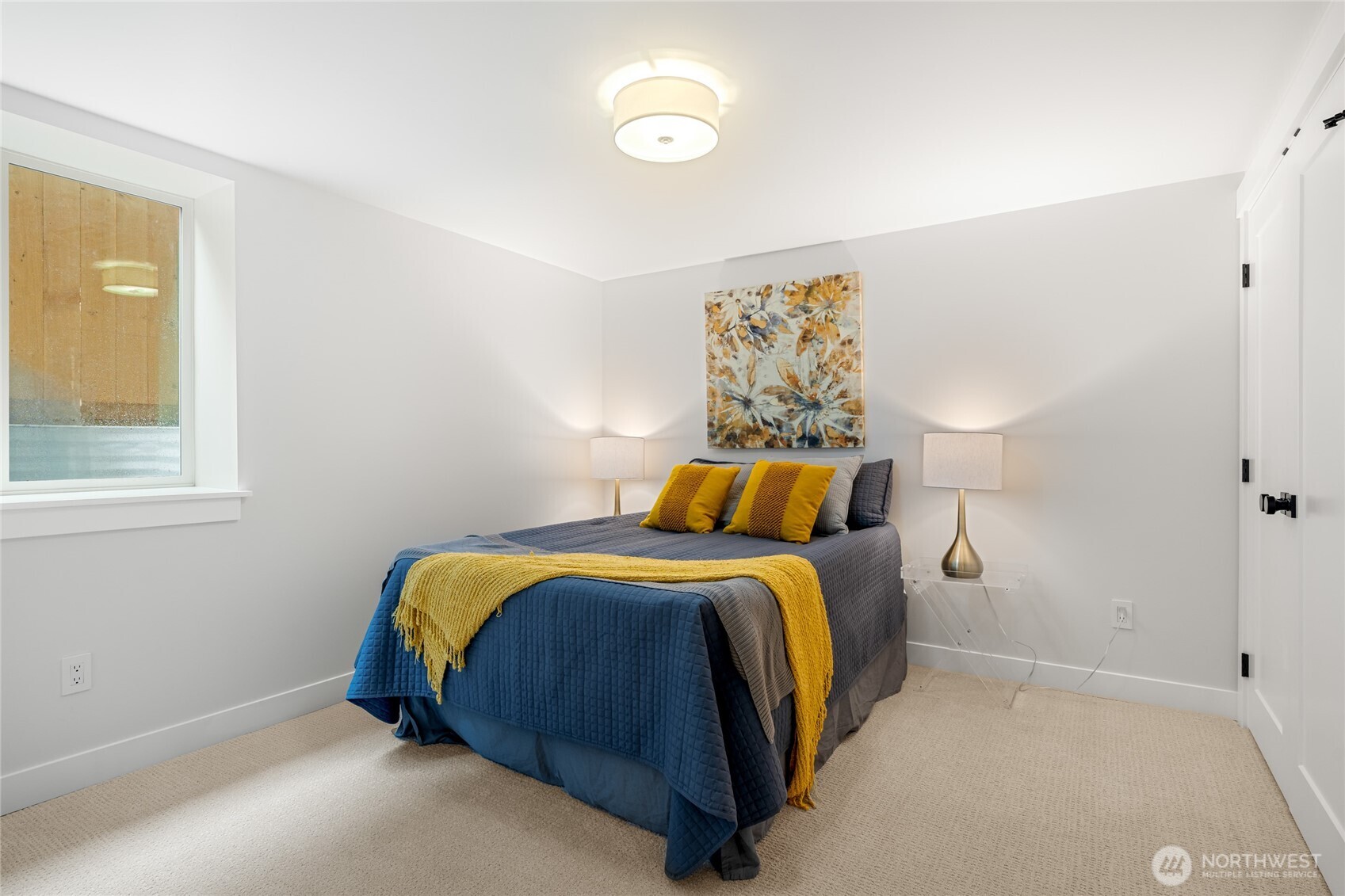 1616 21st Avenue Seattle, WA 98122 - Photo 24 of 26 a bedroom with a bed and a window