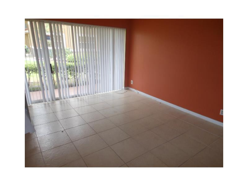 9001 Wiles Road, Unit 101 Coral Springs, FL 33067 - Photo 6 of 10 Living Room