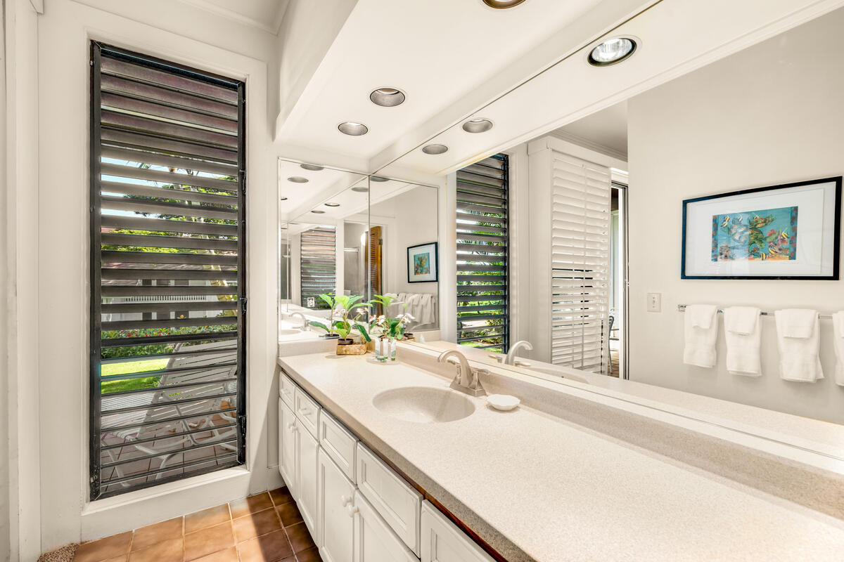 2253 Poipu Road, Unit 241 Koloa, HI 96756 - Photo 13 of 30 a bathroom with a granite countertop sink and a large mirror