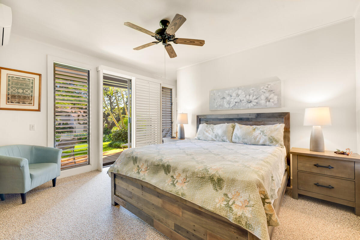 2253 Poipu Road, Unit 241 Koloa, HI 96756 - Photo 16 of 30 a bedroom with a bed a couch and a window