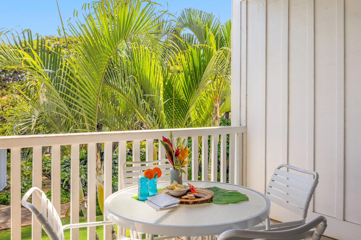 2253 Poipu Road, Unit 241 Koloa, HI 96756 - Photo 20 of 30 a view of a balcony that has a table and chairs