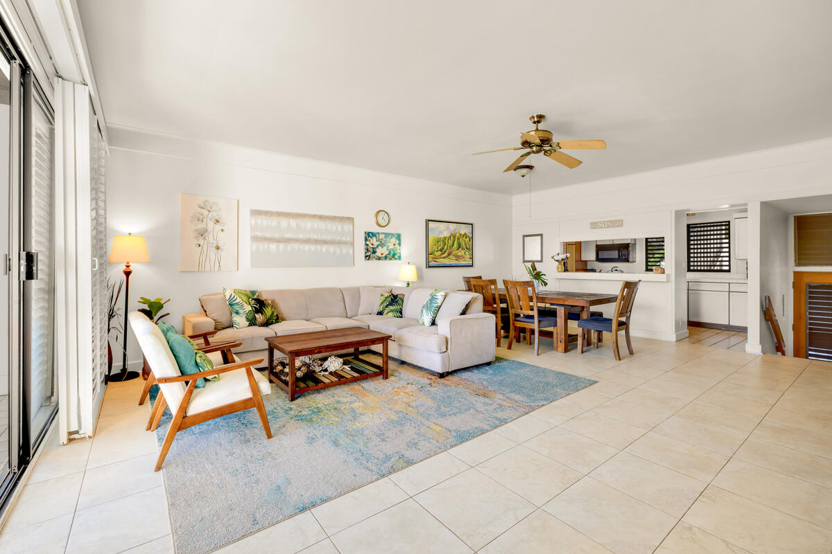 2253 Poipu Road, Unit 241 Koloa, HI 96756 - Photo 5 of 30 a living room with furniture and a dining table with kitchen view