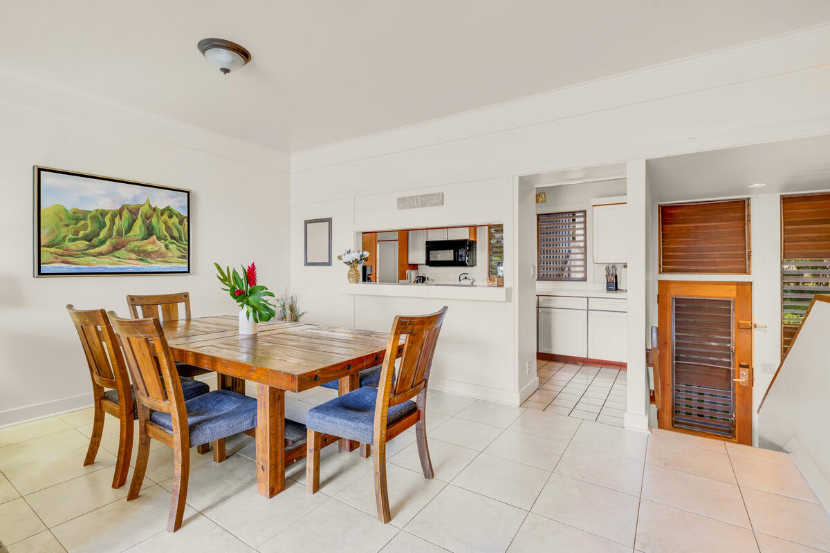 2253 Poipu Road, Unit 241 Koloa, HI 96756 - Photo 10 of 30 a view of a dining room with furniture and wooden floor