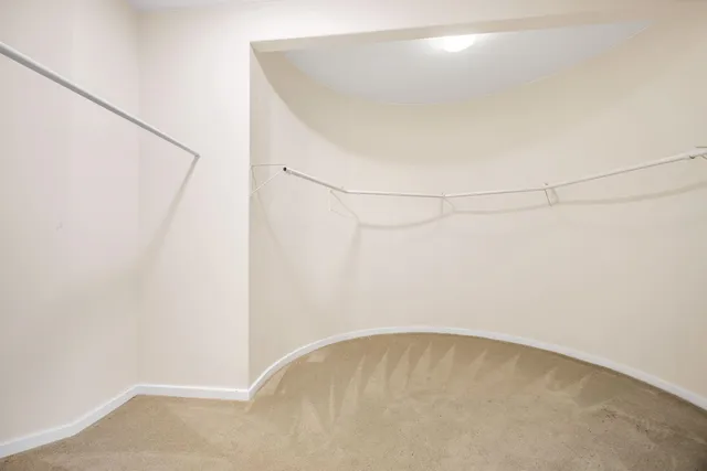 a bathroom with double sink and a toilet