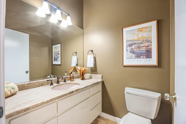 a workspace with furniture and a large window