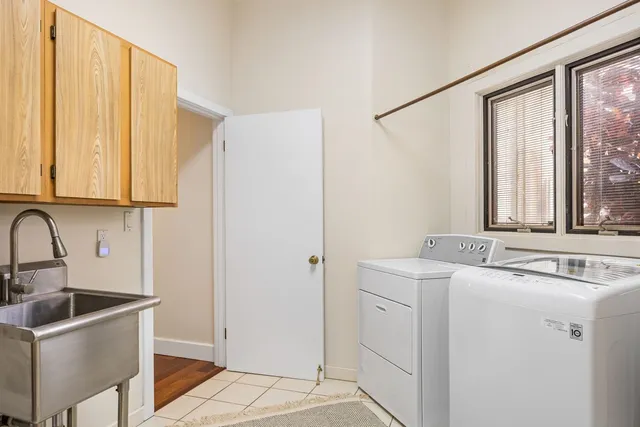 a kitchen with a sink stove and microwave