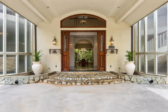 a front view of a house with garden