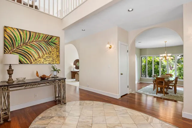 a kitchen with a sink cabinets and wooden floor