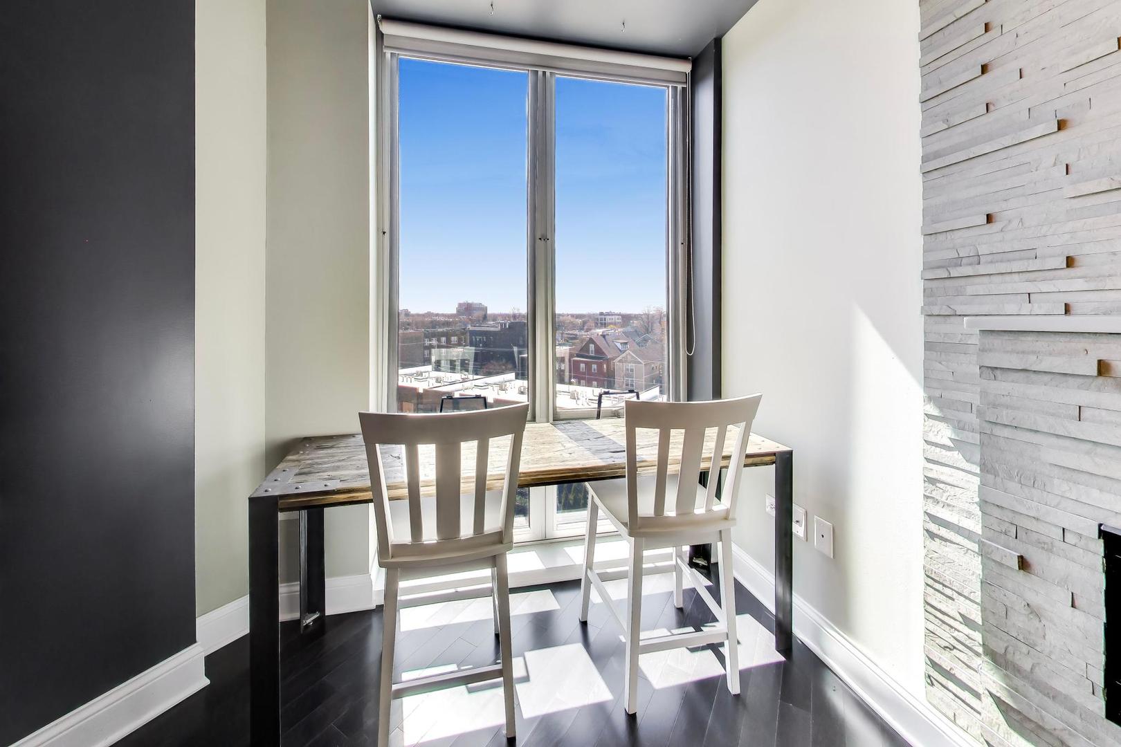 4846 North Clark Street, Unit 510 Chicago, IL 60640 - Photo 12 of 32 a view of a balcony with table and chairs