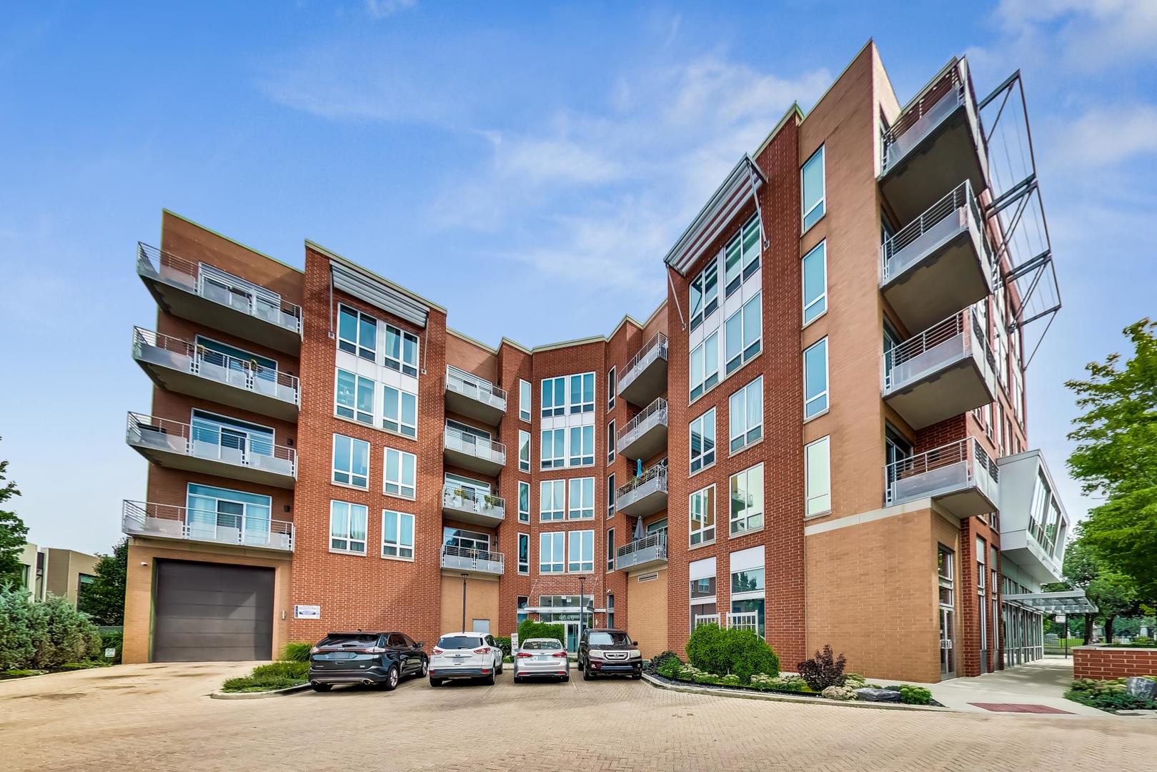 4846 North Clark Street, Unit 510 Chicago, IL 60640 - Photo 2 of 32 a front view of a building with lot of windows
