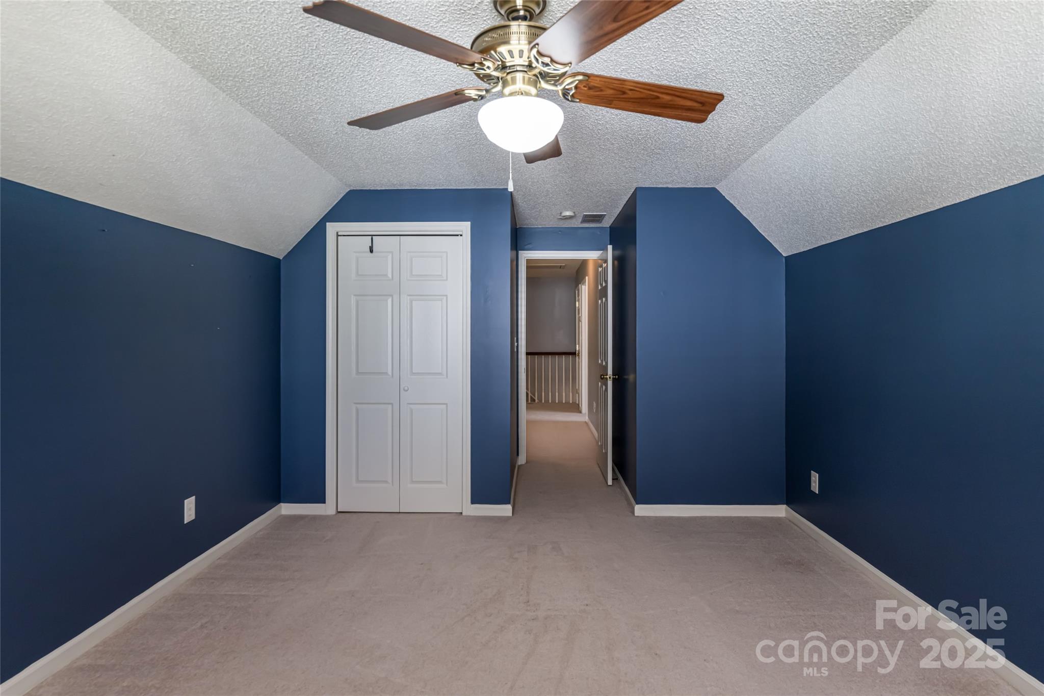 153 Rolling Meadow Road Fletcher, NC 28732 - Photo 18 of 34 en empty room with windows and fan