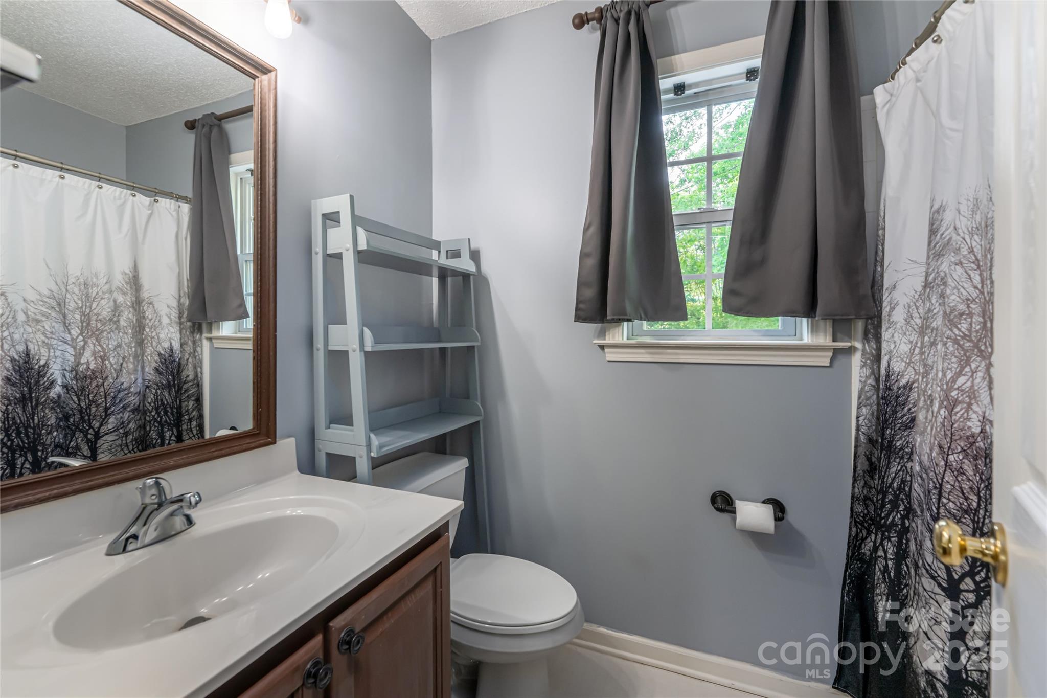 153 Rolling Meadow Road Fletcher, NC 28732 - Photo 20 of 34 a bathroom with a sink toilet and shower