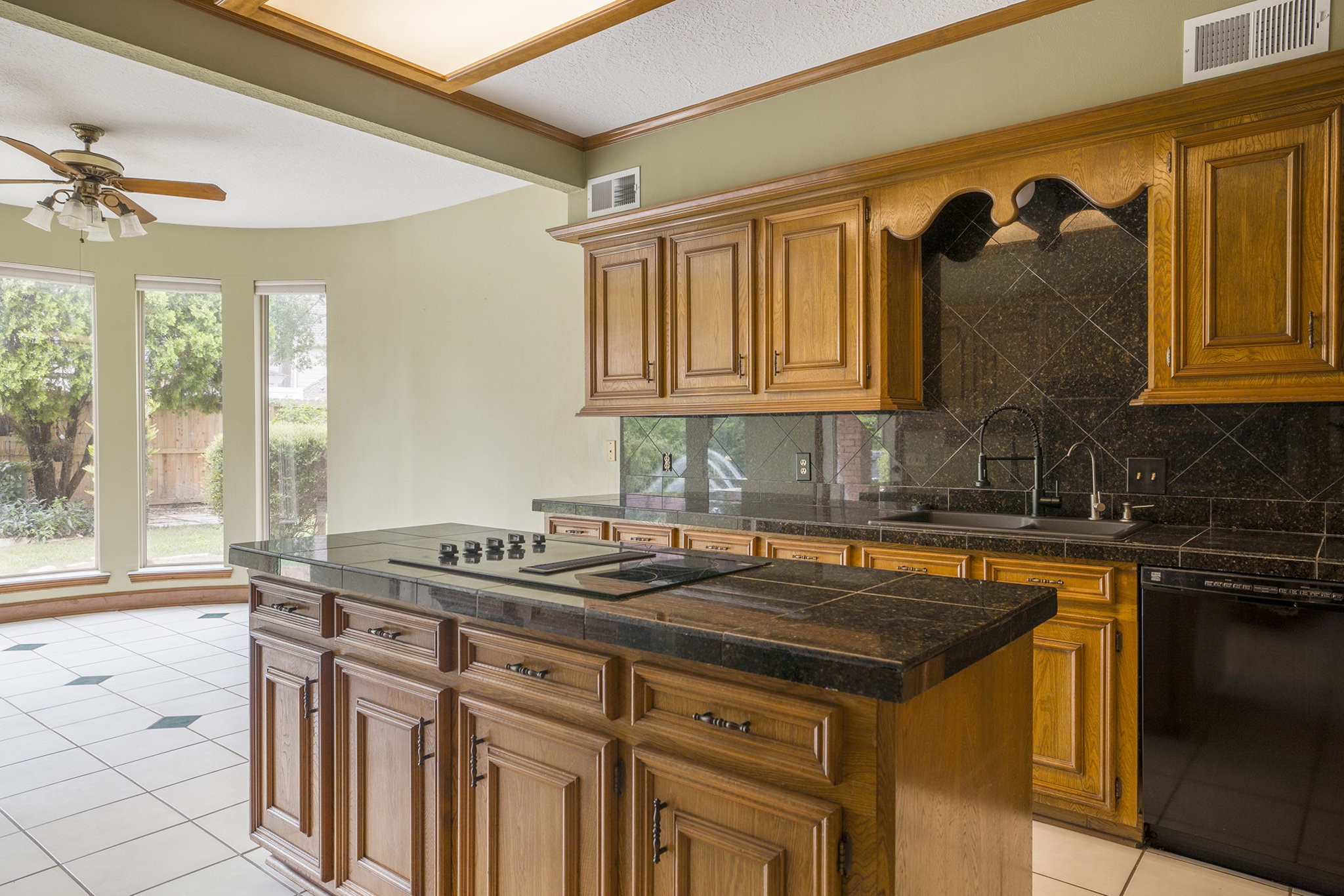 6039 Spanish Oak Way Spring, TX 77379 - Photo 16 of 38 a kitchen with a sink stove and cabinets