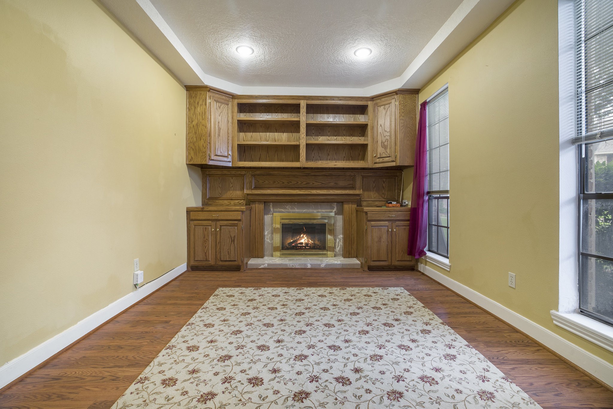 6039 Spanish Oak Way Spring, TX 77379 - Photo 18 of 38 a living room with a fireplace