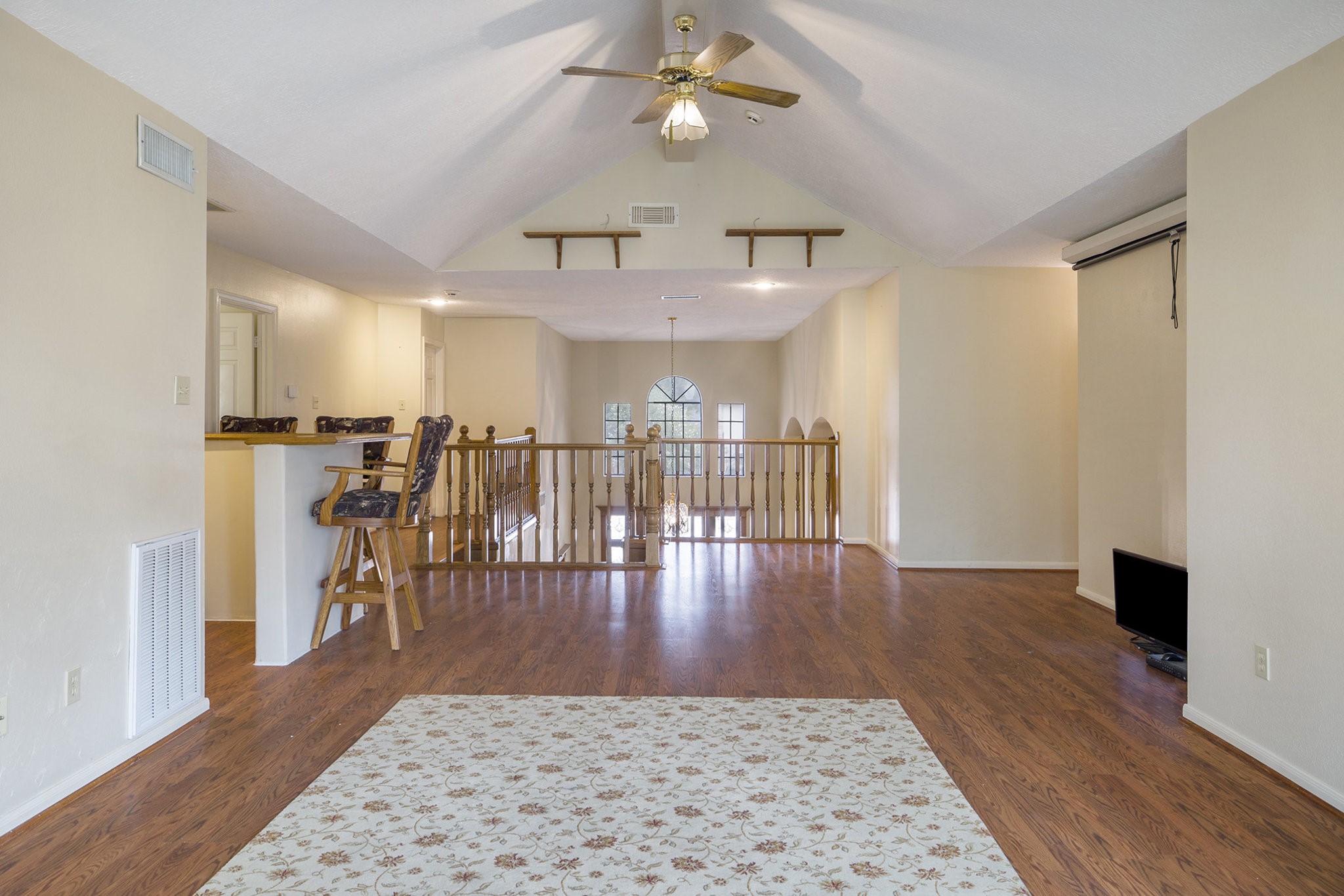6039 Spanish Oak Way Spring, TX 77379 - Photo 26 of 38 a view of a livingroom with furniture wooden floor a ceiling fan and a window