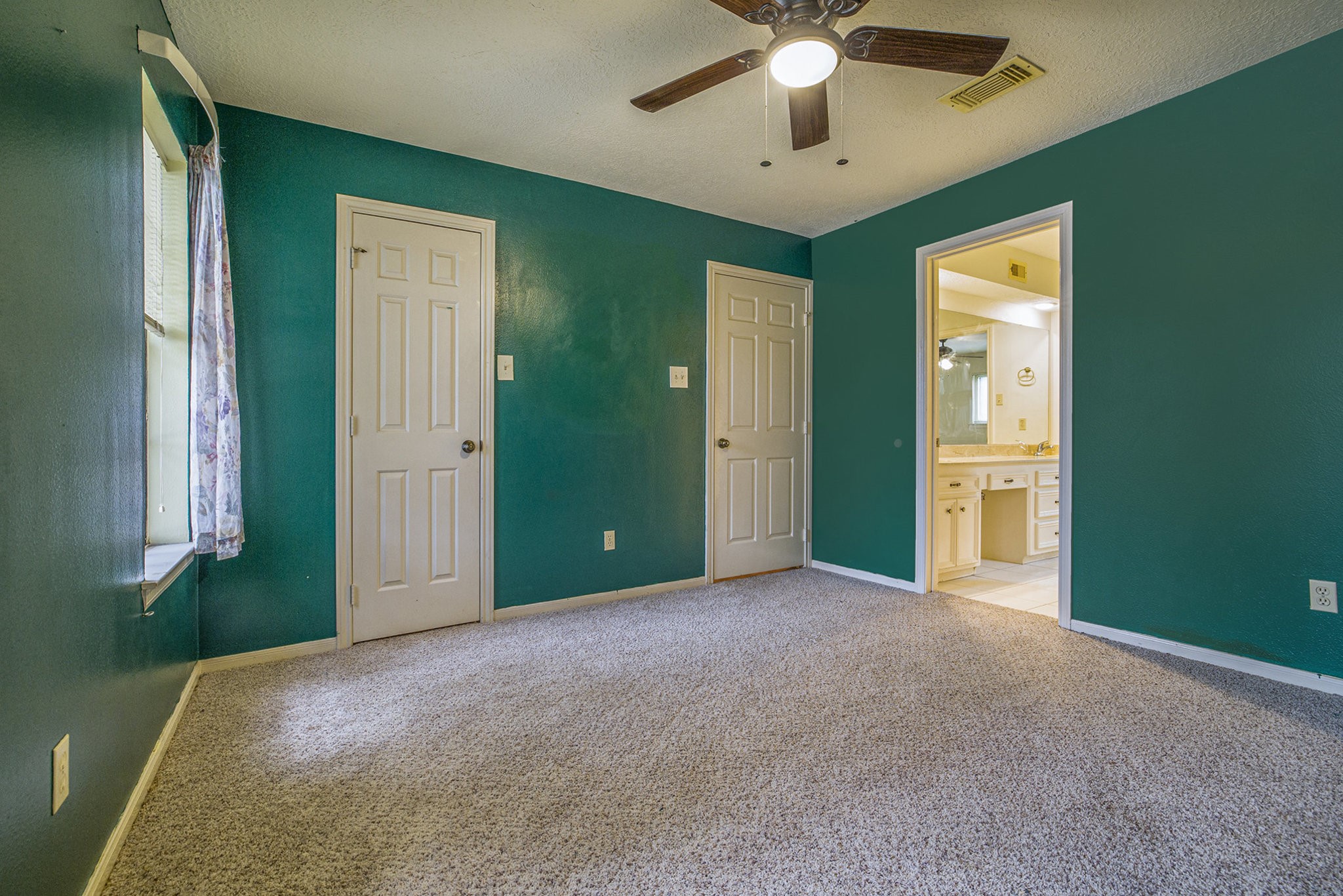 6039 Spanish Oak Way Spring, TX 77379 - Photo 31 of 38 an empty room with chandelier fan and windows
