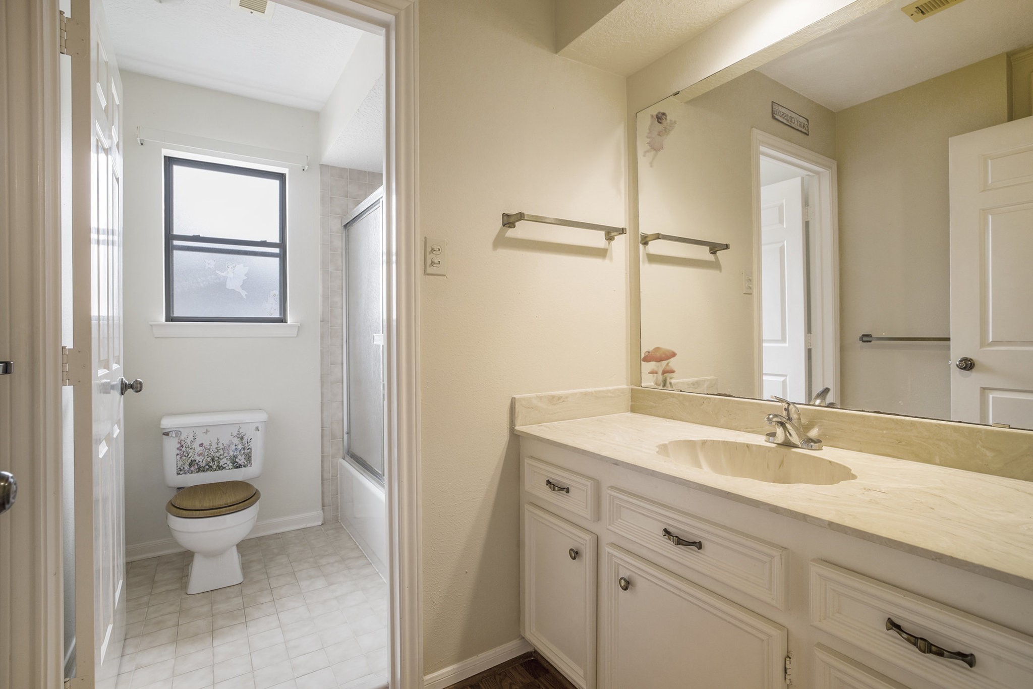 6039 Spanish Oak Way Spring, TX 77379 - Photo 35 of 38 a bathroom with a toilet a sink and mirror