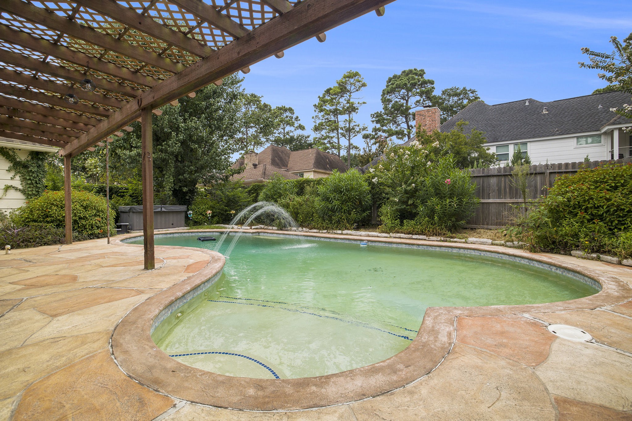 6039 Spanish Oak Way Spring, TX 77379 - Photo 37 of 38 a view of a swimming pool with a yard