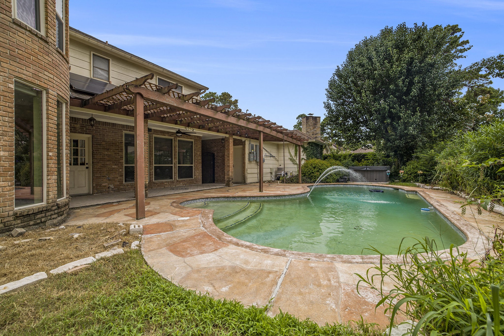 6039 Spanish Oak Way Spring, TX 77379 - Photo 38 of 38 a view of a house with a swimming pool