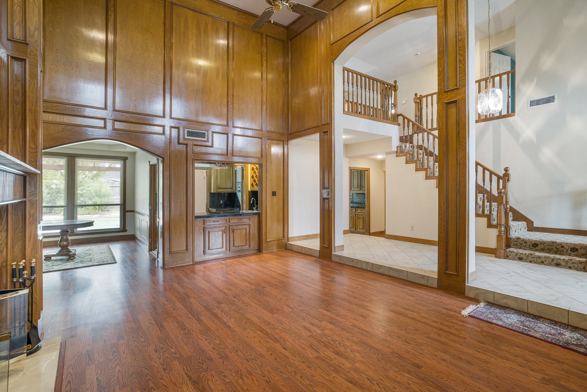 6039 Spanish Oak Way Spring, TX 77379 - Photo 8 of 38 a view of an entryway with wooden floor and a living room