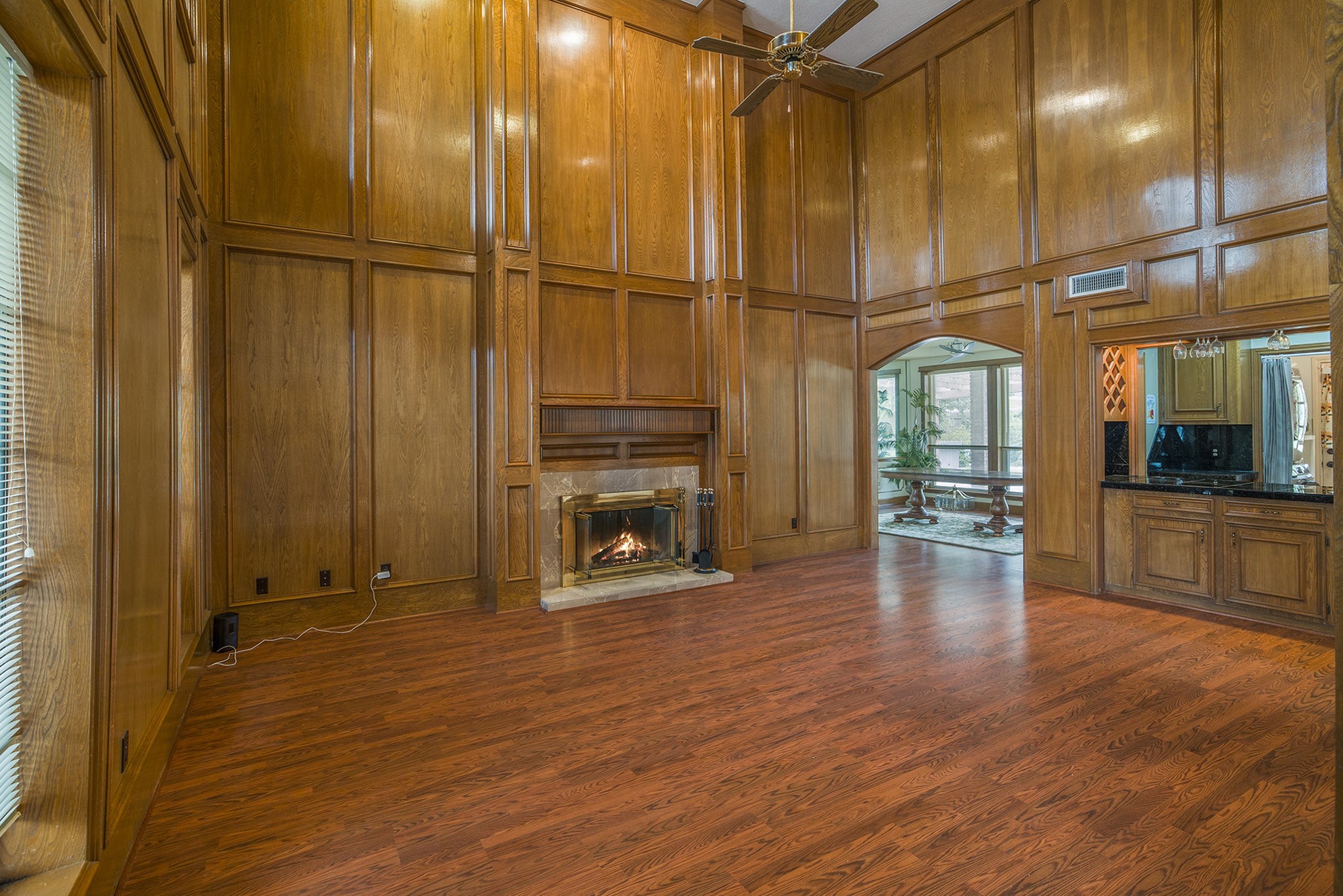 6039 Spanish Oak Way Spring, TX 77379 - Photo 9 of 38 an empty room with wooden floor and a bathroom