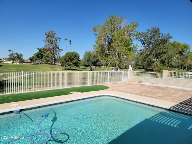 a living room with furniture a dining table and kitchen view