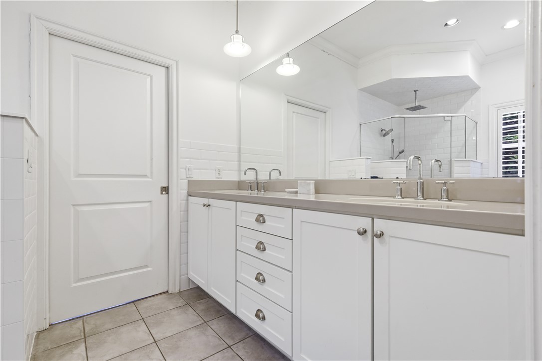 2116 Cavalla Road Vero Beach, FL 32963 - Photo 9 of 23 a bathroom with a double vanity sink and mirror