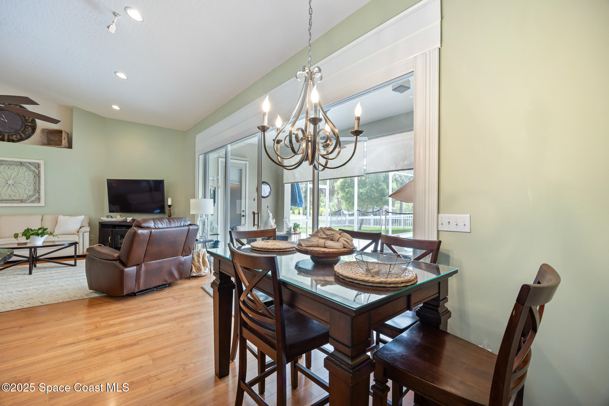 7210 Wando Avenue Grant, FL 32949 - Photo 13 of 41 a view of a dining room with furniture window and wooden floor