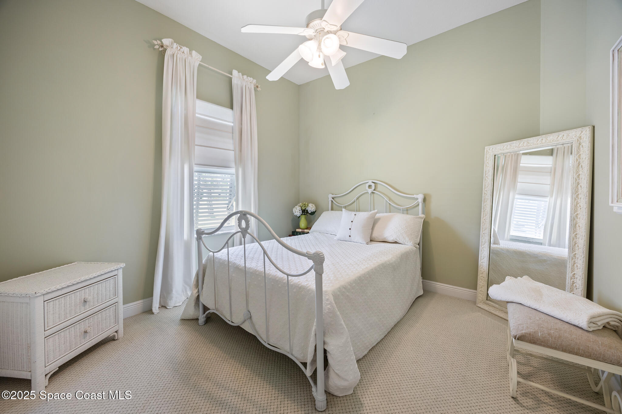 7210 Wando Avenue Grant, FL 32949 - Photo 20 of 41 a bed room with a bed and a chandelier
