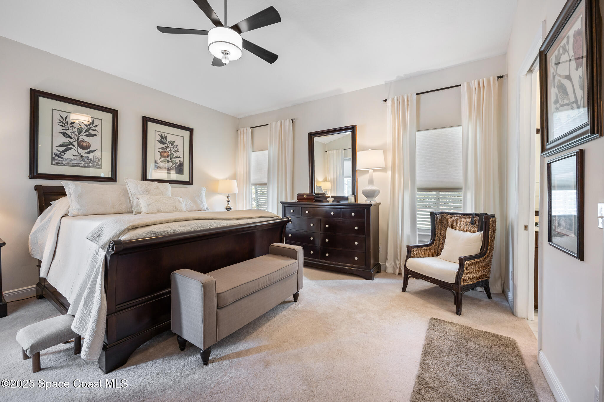 7210 Wando Avenue Grant, FL 32949 - Photo 25 of 41 a bedroom with a bed couch and window