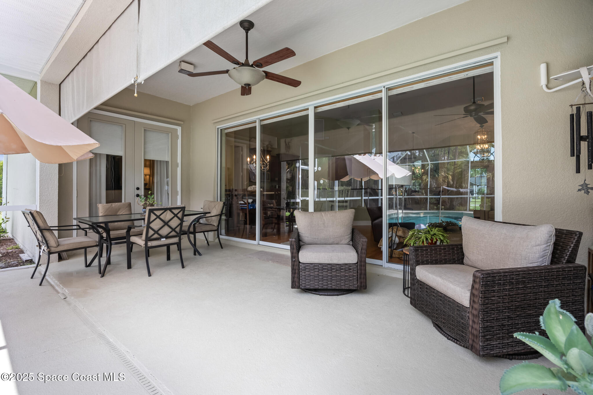 7210 Wando Avenue Grant, FL 32949 - Photo 31 of 41 a view of a patio with dining table and chairs