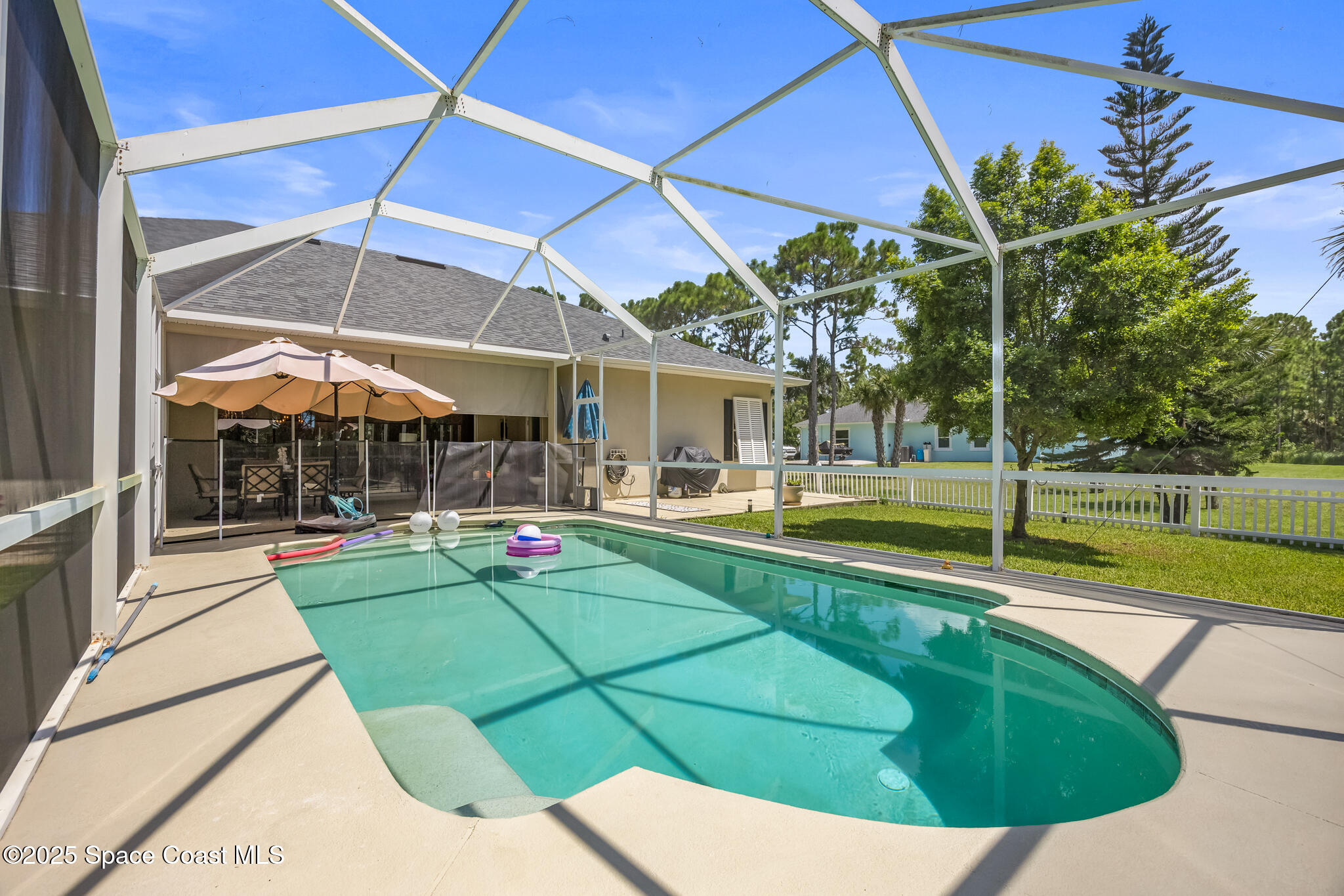 7210 Wando Avenue Grant, FL 32949 - Photo 34 of 41 a view of a swimming pool with a patio