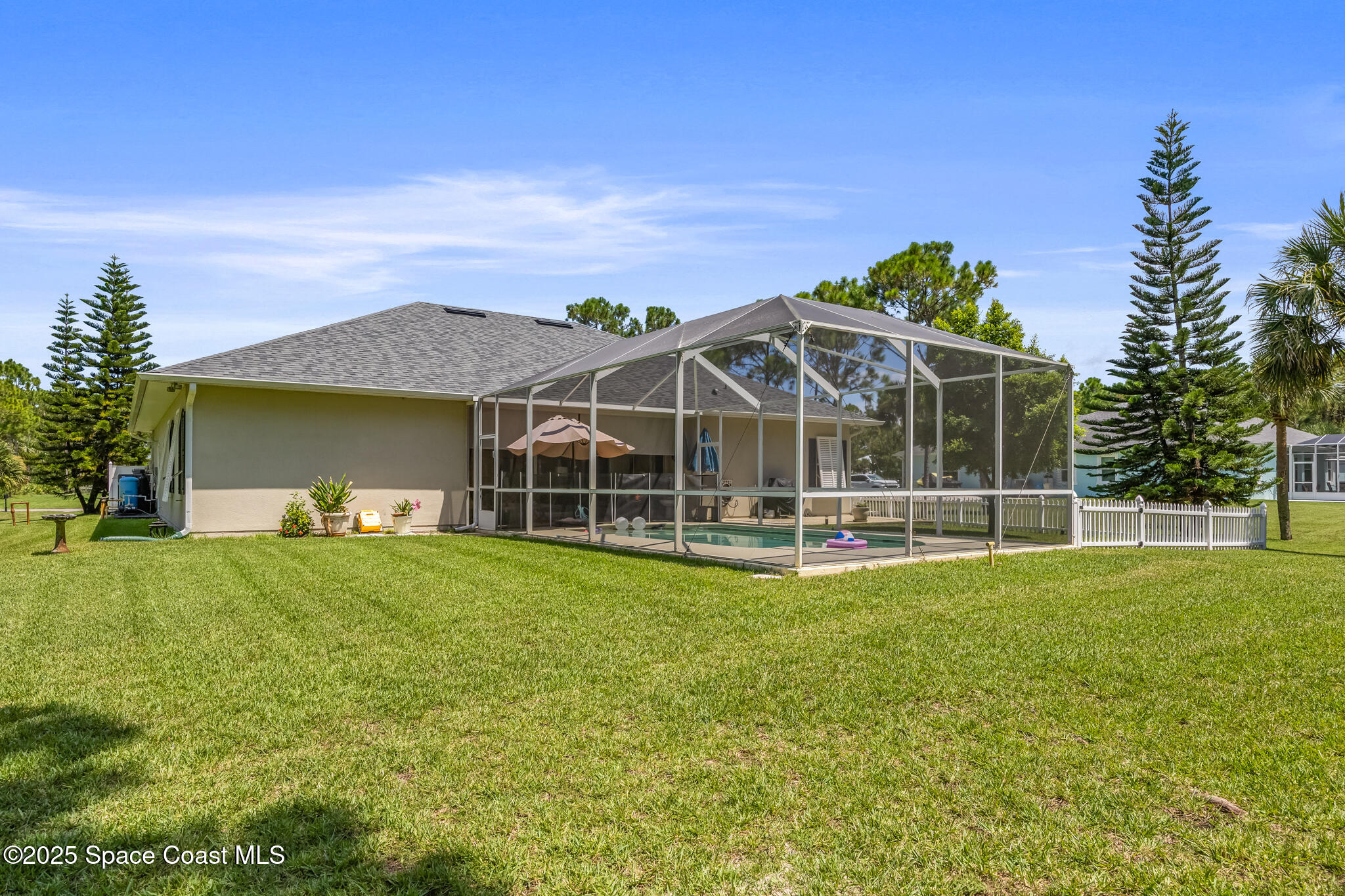 7210 Wando Avenue Grant, FL 32949 - Photo 36 of 41 a view of a house with a big yard and large trees