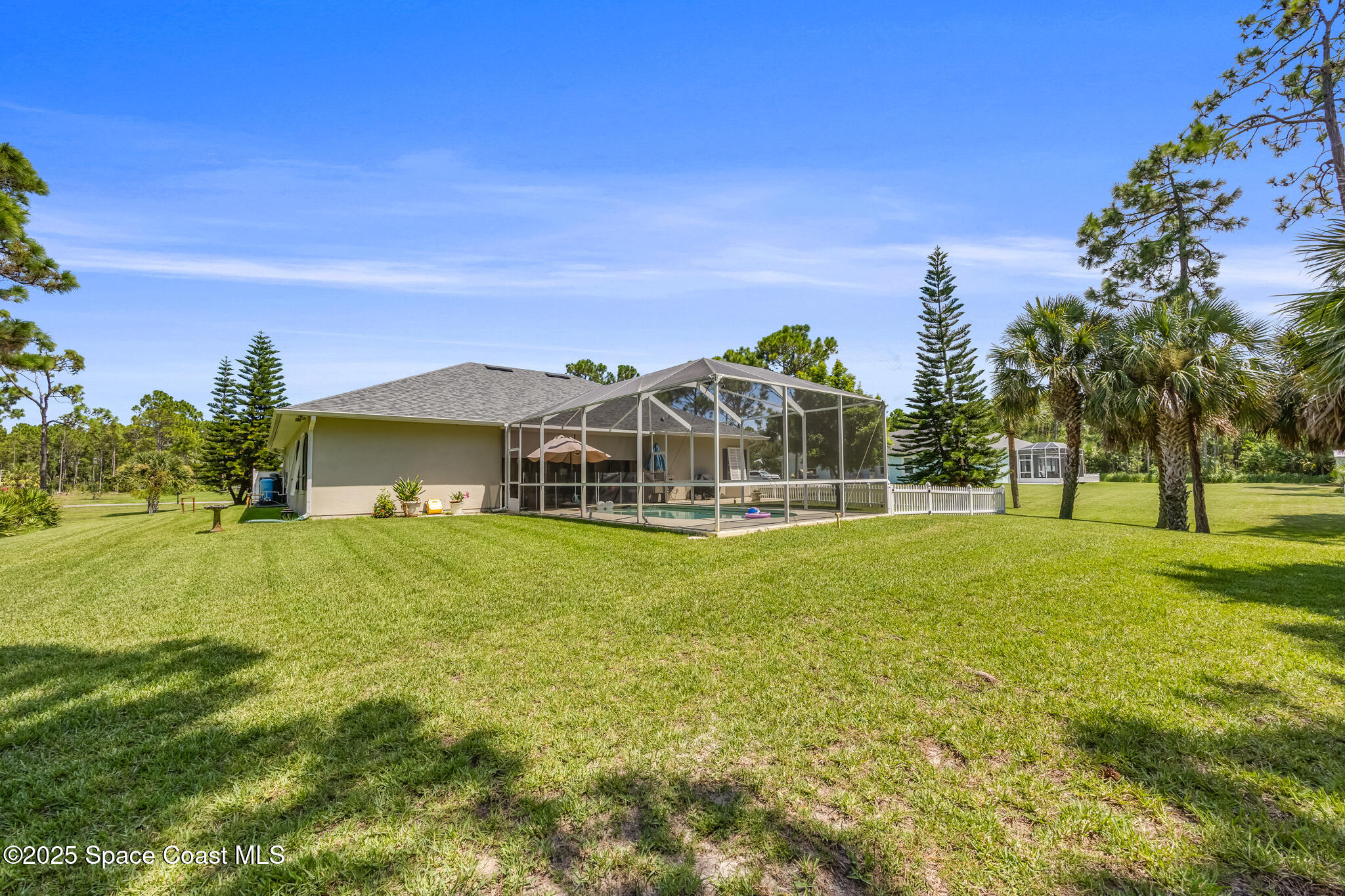 7210 Wando Avenue Grant, FL 32949 - Photo 38 of 41 a front view of a house with a big yard