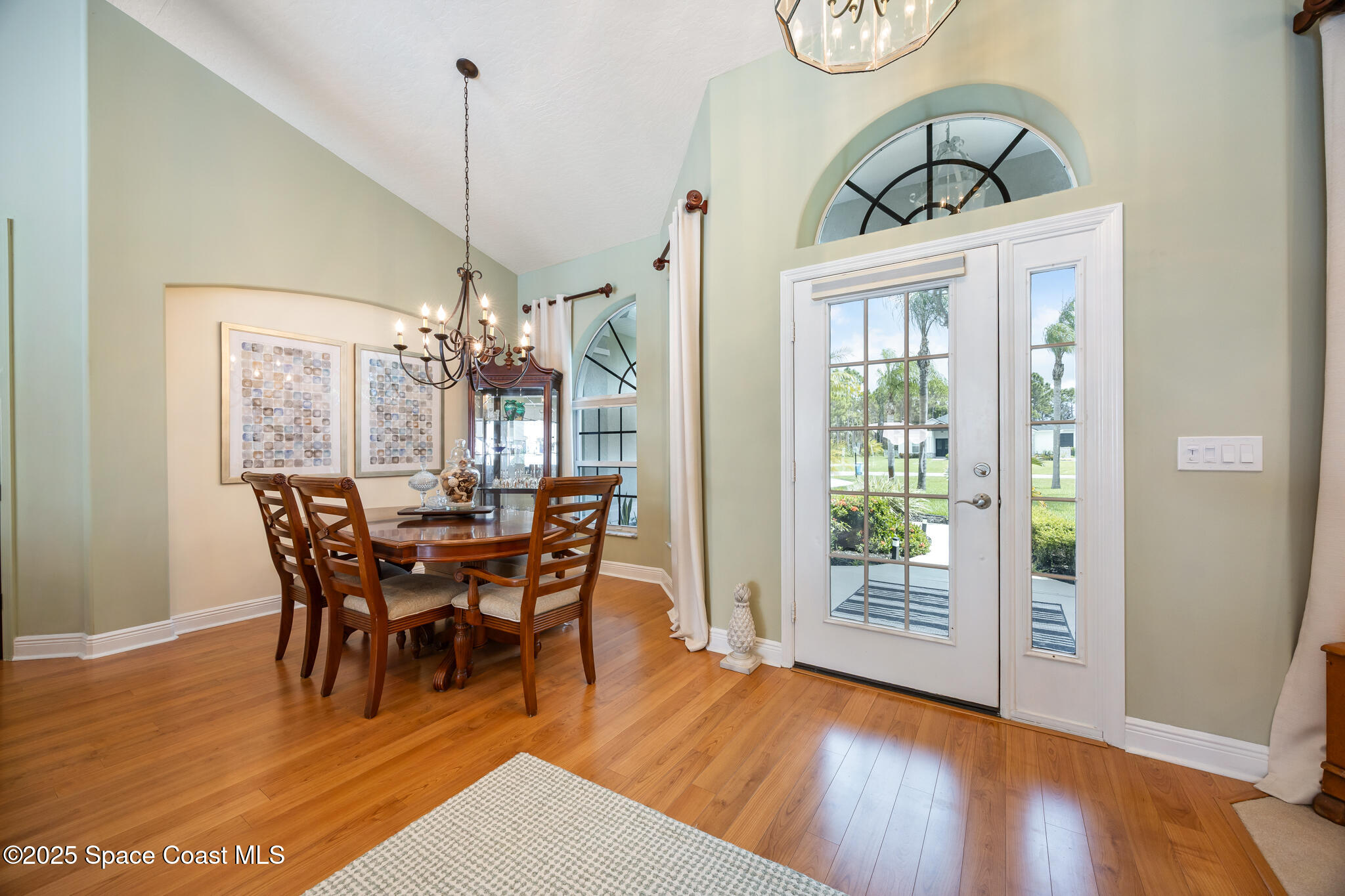 7210 Wando Avenue Grant, FL 32949 - Photo 6 of 41 a view of a dining room with furniture window and wooden floor